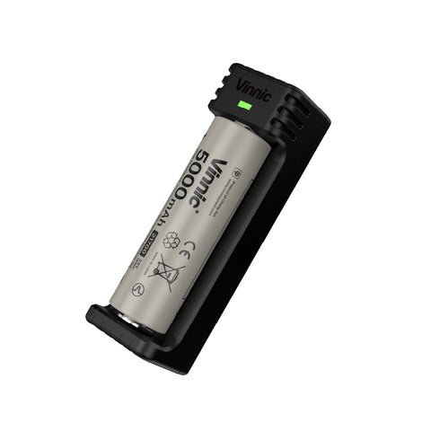 Vinnic 21700 battery with black charger on a white background